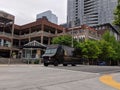 Bellevue, WA USA - circa June 2020: Street view of a UPS delivery truck driving around downtown Bellevue, making deliveries