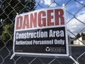 Bellevue, WA USA - circa June 2020: View of a `Danger: Construction Area` sign on a chainlink fence