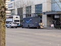 Bellevue, WA USA - circa March 2021: Street view of an Amazon Prime delivery driver unloading boxes from the van Royalty Free Stock Photo