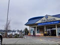 BellExterior view of Uwajimaya Asian Grocery store front as customers are entering and