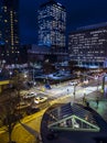 Rooftop view of rush hour traffic and night life starting up in downtown in the late Royalty Free Stock Photo