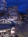 Rooftop view of rush hour traffic and night life starting up in downtown in the late Royalty Free Stock Photo