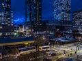 Rooftop view of rush hour traffic and night life starting up in downtown in the late Royalty Free Stock Photo