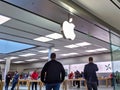 Technology crazed customers shopping inside an Apple store, scoping out iPhones and iMacs before Black Friday 2019