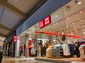 Uniqlo clothing store in a mall, with lots of different fall and winter clothing on display and on sale. Royalty Free Stock Photo