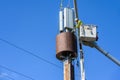 Two linemen up in the air installing 5G, new technology, wireless communications on a wood