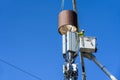 Two linemen up in the air installing 5G, new technology, wireless communications on a wood