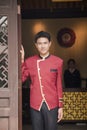 Bellhop smiling at Hotel Entrance, portrait