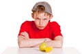 Belligerent young boy with fruit Royalty Free Stock Photo