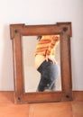 Bellly of pregnant tropical girl mirroring in mirror Royalty Free Stock Photo