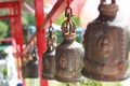 A medium sized bell adorned by Buddhist temples.