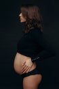 belly body pregnant woman posing black background