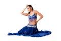 Belly dancer sitting in blue dress Royalty Free Stock Photo