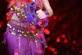 Belly Dancer wearing purple dance costume close up with bokeh Royalty Free Stock Photo