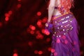 Belly Dancer wearing purple dance costume close up with bokeh Royalty Free Stock Photo