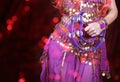 Belly Dancer wearing purple dance costume close up with bokeh Royalty Free Stock Photo