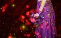 Belly Dancer wearing purple dance costume close up with bokeh Royalty Free Stock Photo
