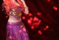 Belly Dancer wearing purple dance costume close up with bokeh Royalty Free Stock Photo