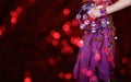 Belly Dancer wearing purple dance costume close up with bokeh Royalty Free Stock Photo