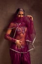 Belly-dancer woman in afghani pants, purdah and adornment Royalty Free Stock Photo