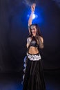 Belly dancer. Young attractive woman dancing tribal fusion on the stage. Oriental exotic dance. Royalty Free Stock Photo