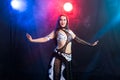 Belly dancer. Young attractive woman dancing tribal fusion on the stage. Oriental exotic dance. Royalty Free Stock Photo