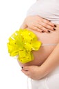 Belly pregnant girl with a bow Royalty Free Stock Photo