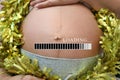 Belly of pregnant women and loading text in concept of time in c