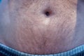 Bellybutton from a young white male Caucasian.