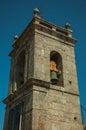 Medieval steeple made of stone with bell and staircase