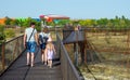 Visitors walk along the footpaths above the predator enclosures. Park `Taigan`, Crimea