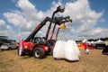 Belogorye, Khmelnytsky region, UKRAINE - August 19, 2021: Loader Manitou with bags of seeds at the exhibition. Tractor parked in a