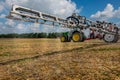 Belogorye, Khmelnytsky region, UKRAINE - August 19, 2021: sprayer boom trailed sprayer fertilizer on at the demonstration of