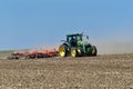 John Deere 8400R tractor pulling a Kuhn Excelerator 8000 tiller