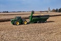 John Deere 9420R tractor pulling a Brent 2096 grain cart loaded with corn