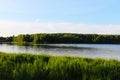 Belorussian landscape blue cloudy sky and green wheat field