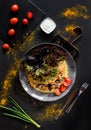 Belorussian National food - draniki. Traditional eating concept. Dark background with plate with pancake with meat with vegetables