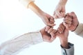 Below business people, fist bump and circle for team building, support and group goals in workplace. Men, women and Royalty Free Stock Photo