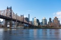 Queensboro Bridge along the East River with the Midtown Manhattan and Roosevelt Island Skyline in New York City Royalty Free Stock Photo