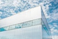 From below shot of shiny glass corner modern business building with blue sky and clouds. Moscow, capital city of Russia. Royalty Free Stock Photo