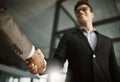 Below of two business peoples handshake during a meeting in an office. Colleagues finalize a successful promotion, deal Royalty Free Stock Photo