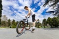 Below view of bmx cyclist jumping against the sky