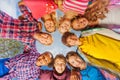 Below view of children standing in circle form