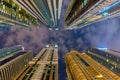 Below view on the luxury modern skyscrapers in Dubai Marina, shot at cloudy night. Royalty Free Stock Photo