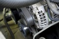 Belt driven power generator on the modern car engine, 12v Alternator Royalty Free Stock Photo