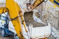 Belt excavator loading a big dumper