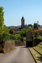 Road leading into the idyllic town of Belves with a view of the Our Lady of Capelou Church