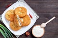 Belyashi - deep-fried meat pies. Patties on a plate on a wooden background Royalty Free Stock Photo