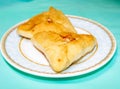 Belyashi. Fried Triangular pies with meat on a plate Royalty Free Stock Photo