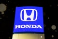 Snow is falling on the Honda Logo sign Royalty Free Stock Photo